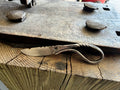 The tagout violation with a visible brand logo on a wooden surface